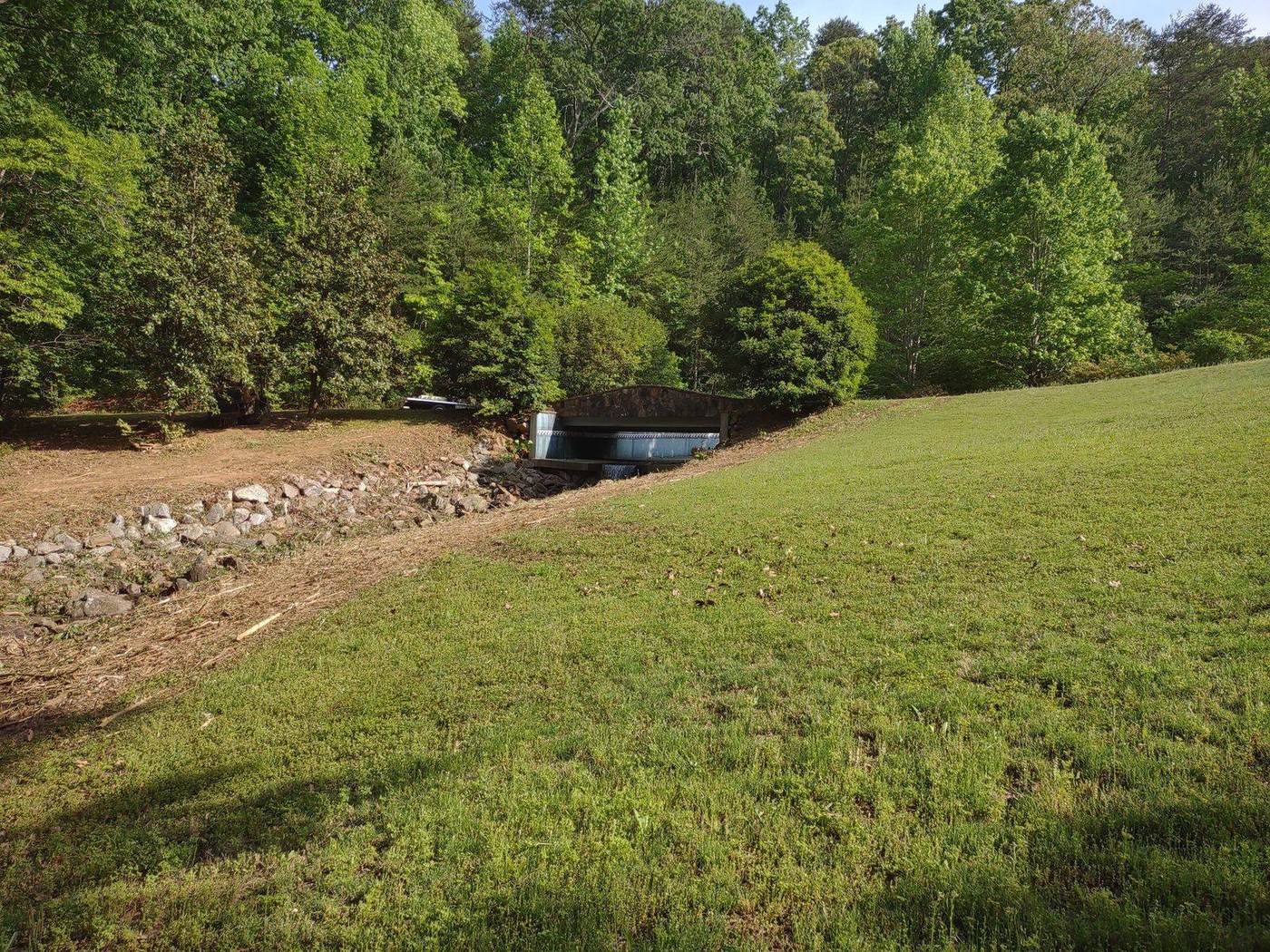 Spillway cleared and regraded after cleanout