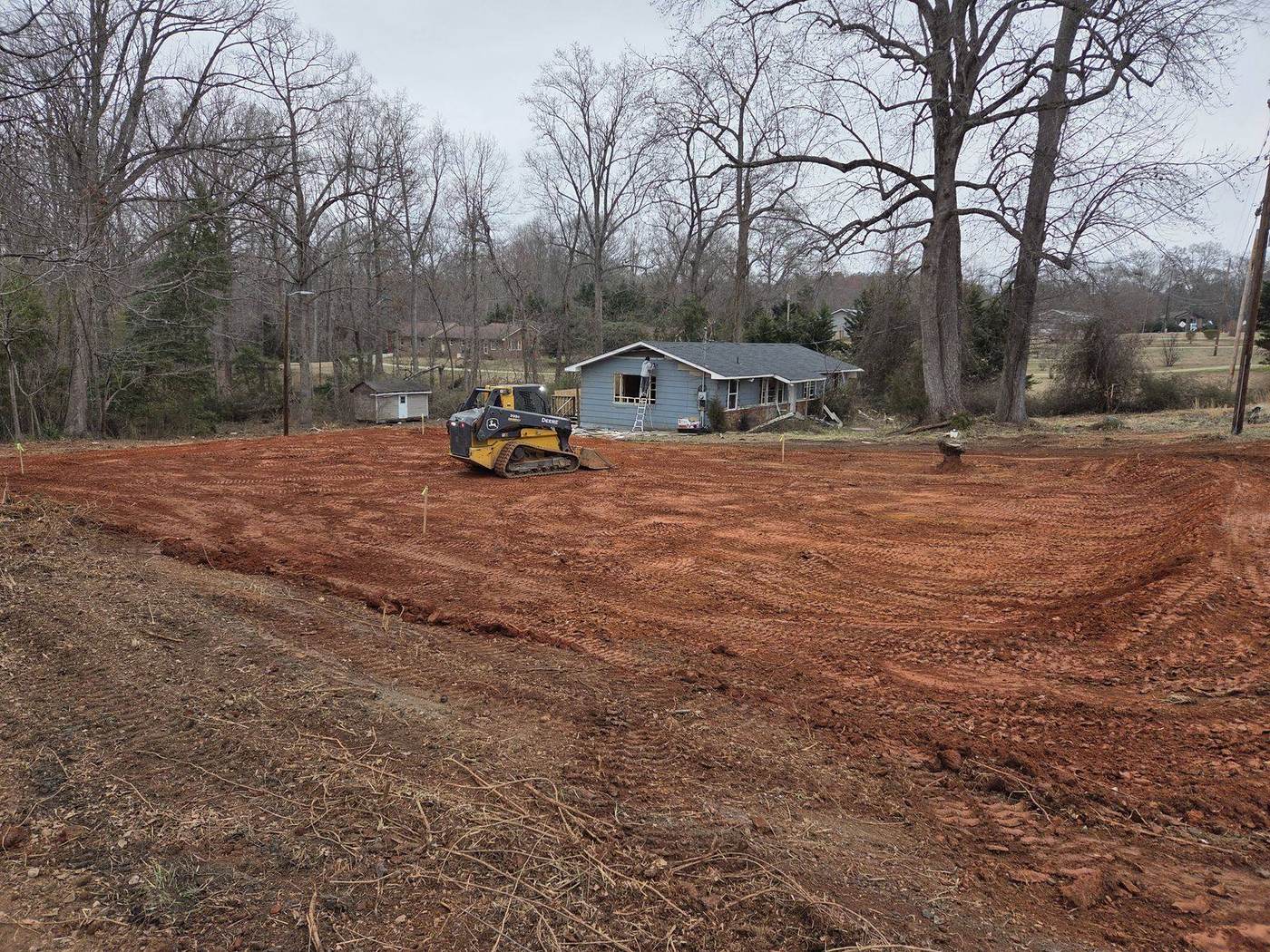Grading and shaping a residential house lot