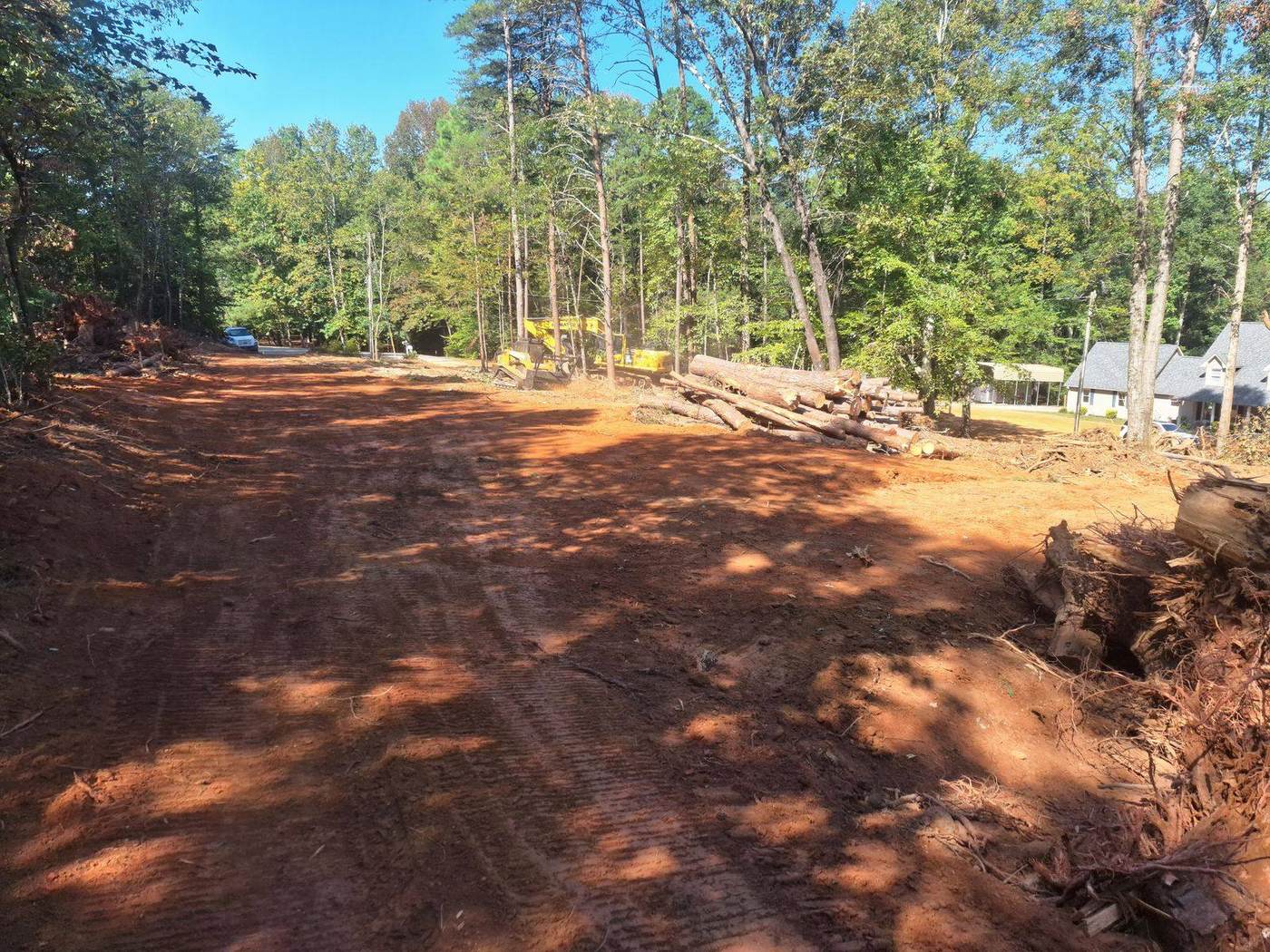 Excavator performing site prep and grading