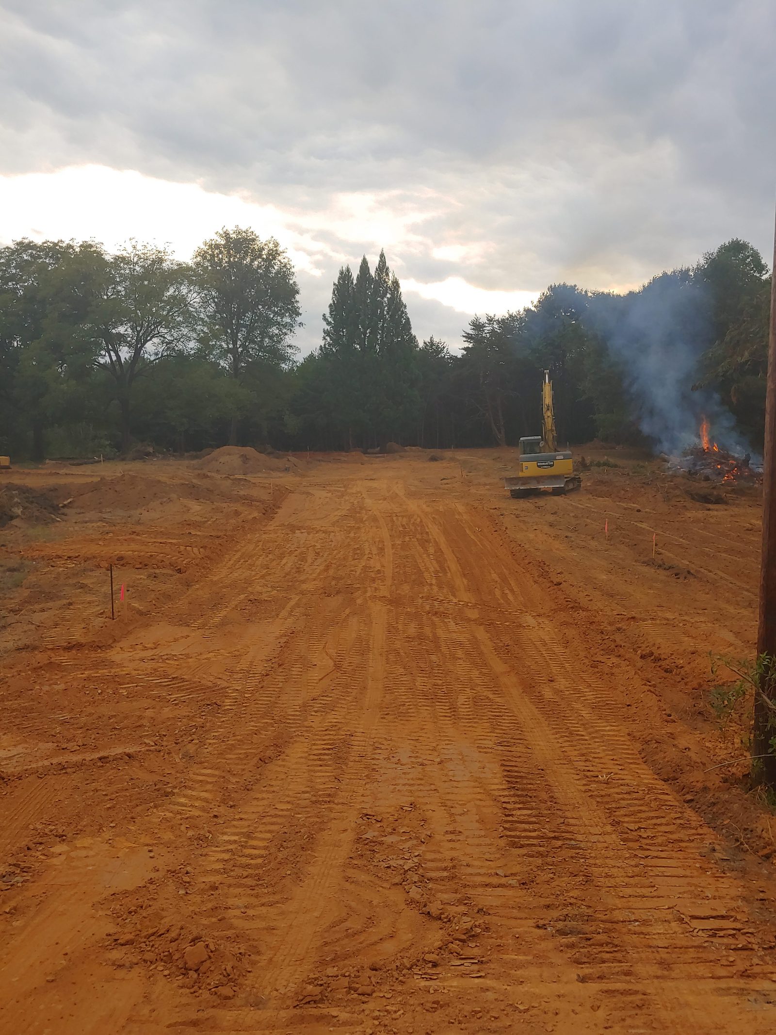 Excavator land clearing a building site in Easley, SC
